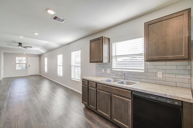 kitchen featuring backsplash, dishwasher, plenty of natural light, and sink