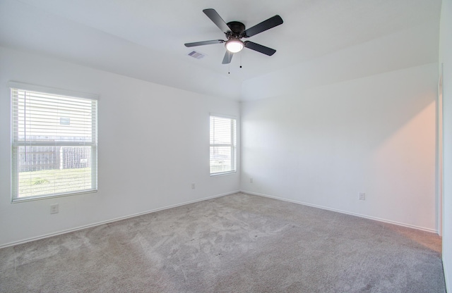 carpeted empty room with ceiling fan