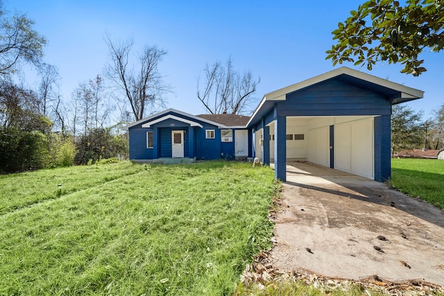 exterior space with a front lawn and a carport