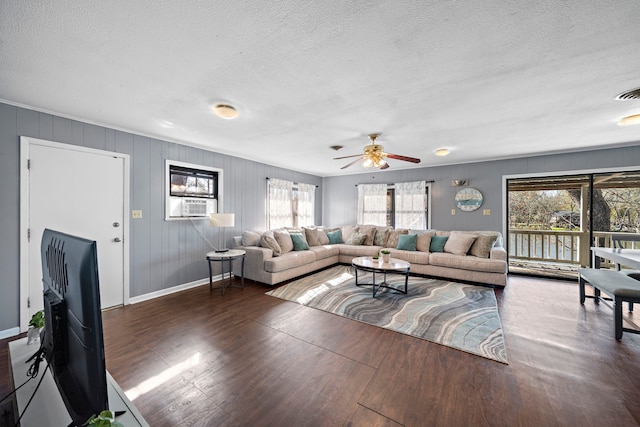 living room featuring a textured ceiling, dark hardwood / wood-style floors, ceiling fan, and cooling unit