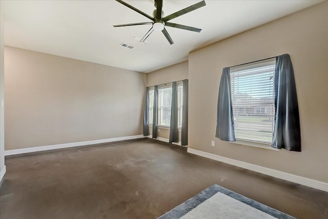 unfurnished room featuring a wealth of natural light and ceiling fan