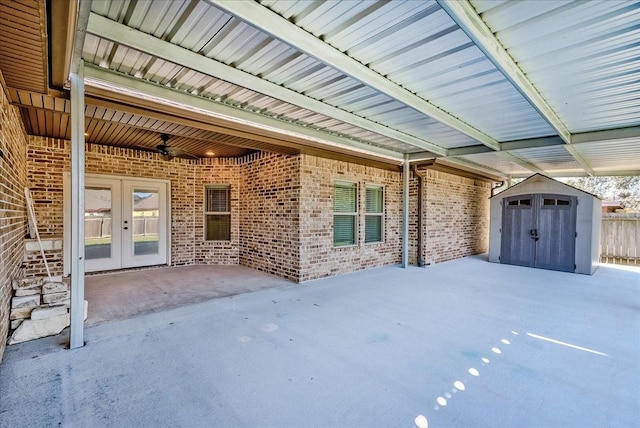 view of patio / terrace with a storage shed and french doors