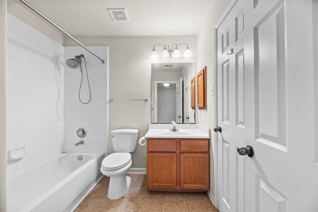 full bathroom featuring tile patterned flooring, toilet, vanity, and tiled shower / bath