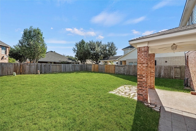 view of yard with ceiling fan