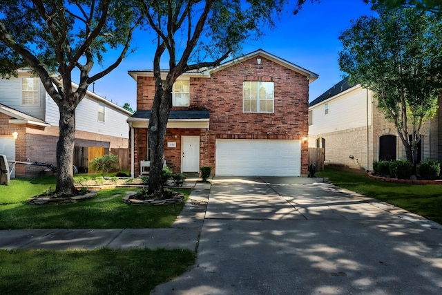 view of front of property with a front lawn and a garage