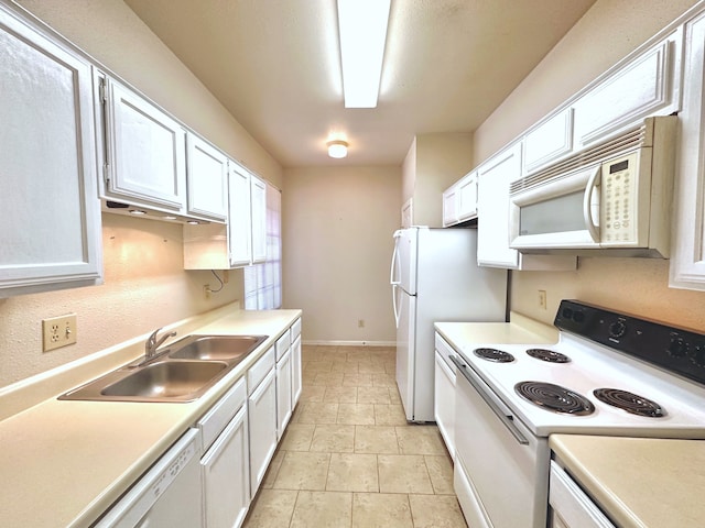 kitchen featuring white cabinetry, white appliances, and sink