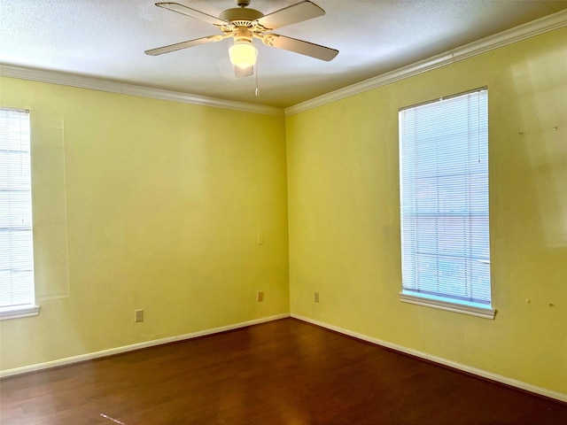 unfurnished room featuring crown molding, ceiling fan, a healthy amount of sunlight, and hardwood / wood-style flooring