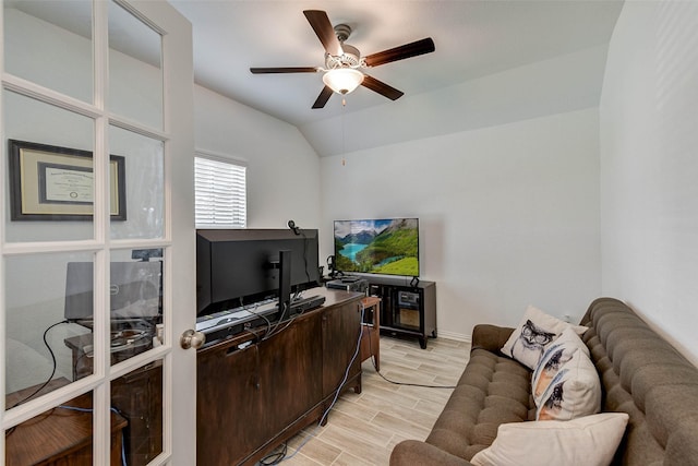 office area featuring light hardwood / wood-style flooring, vaulted ceiling, and ceiling fan