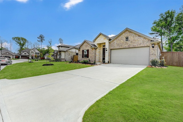 view of front of property with a garage and a front lawn