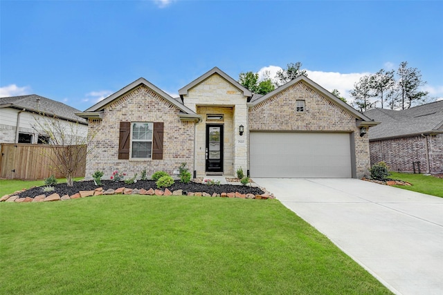 view of front of property featuring a garage and a front lawn