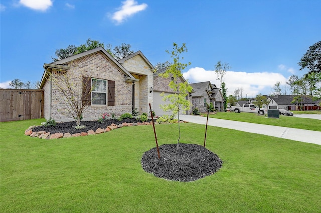 view of front of home with a garage and a front yard