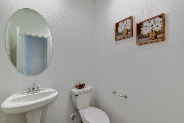 bathroom with sink and toilet