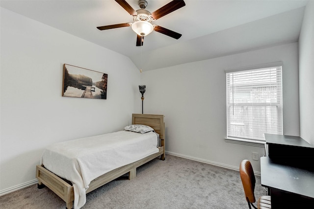 bedroom featuring light carpet, multiple windows, vaulted ceiling, and ceiling fan