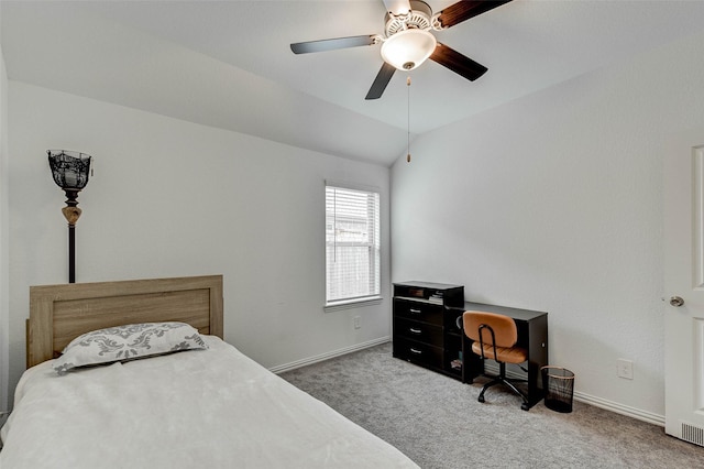 carpeted bedroom with vaulted ceiling and ceiling fan