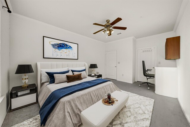 carpeted bedroom featuring ceiling fan and ornamental molding