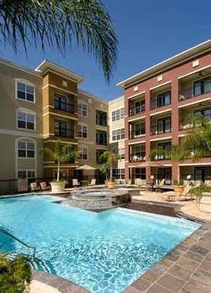 view of swimming pool featuring a hot tub