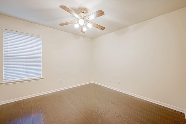 empty room with ceiling fan and wood-type flooring