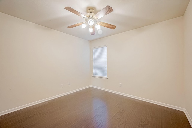 empty room with hardwood / wood-style floors and ceiling fan