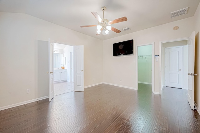 spare room with ceiling fan and wood-type flooring