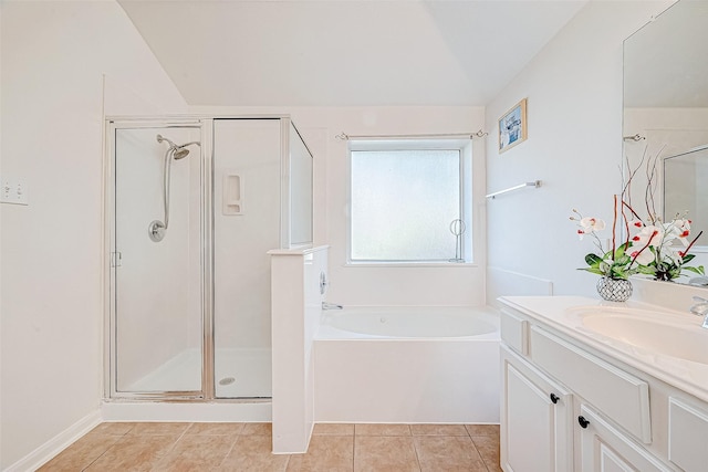 bathroom with tile patterned floors, vanity, vaulted ceiling, and independent shower and bath