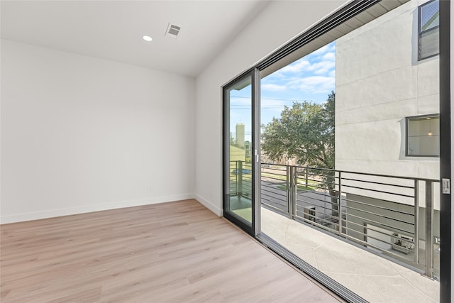 unfurnished room featuring light hardwood / wood-style floors