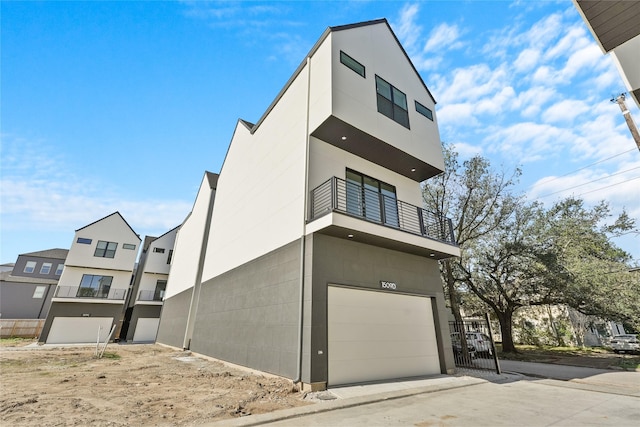 exterior space with a balcony and a garage