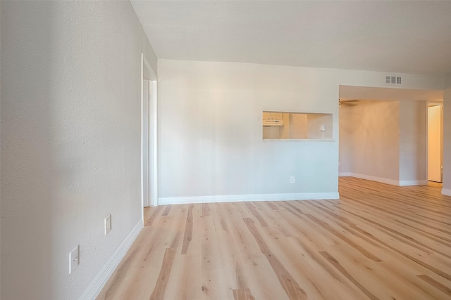 spare room featuring light wood-type flooring