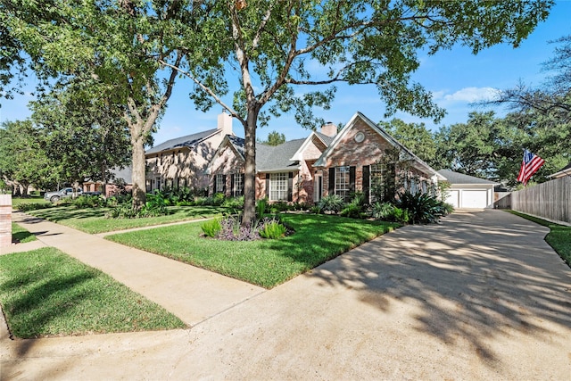 view of front of house with a front lawn and a garage