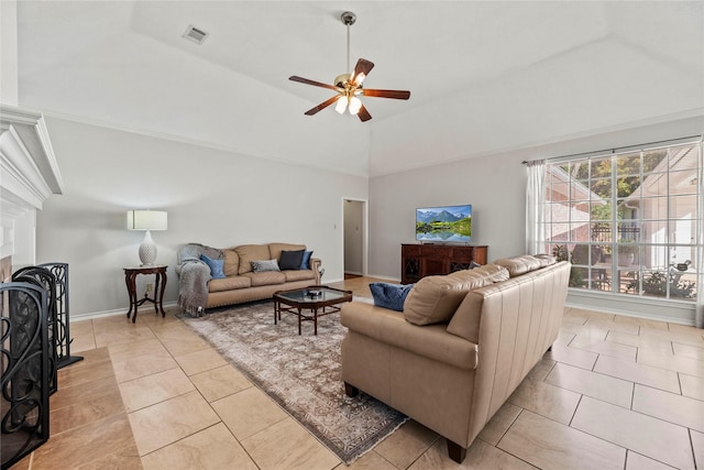 living room featuring ceiling fan, light tile patterned floors, and vaulted ceiling