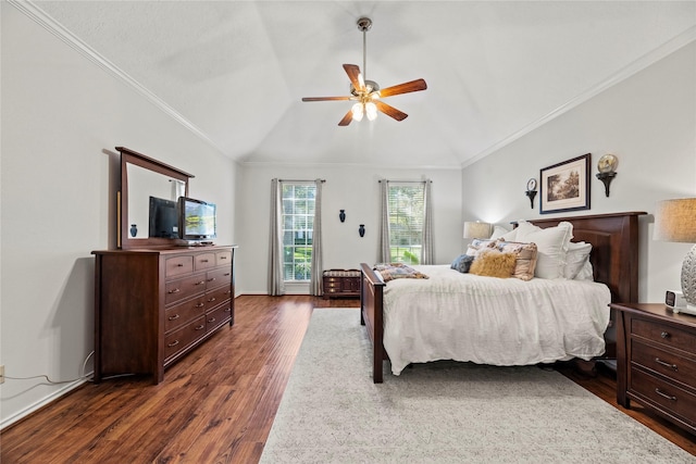 bedroom with ceiling fan, dark hardwood / wood-style floors, vaulted ceiling, and ornamental molding