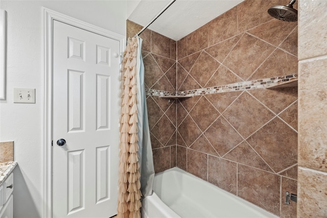 bathroom featuring vanity and shower / bath combination with curtain