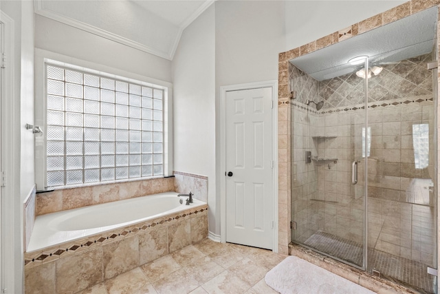 bathroom featuring separate shower and tub, crown molding, and vaulted ceiling