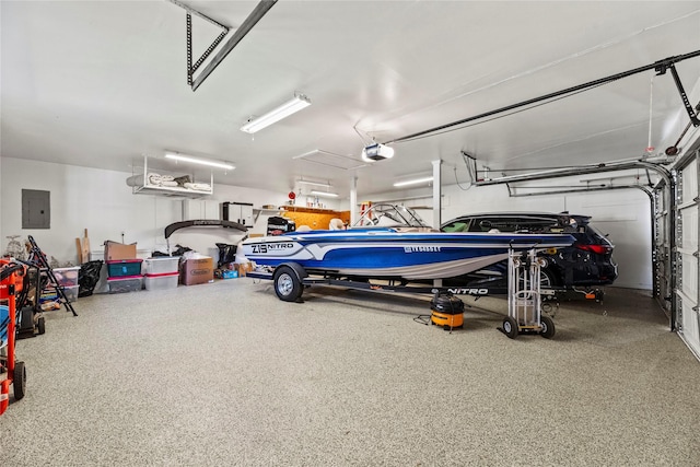 garage with electric panel and a garage door opener