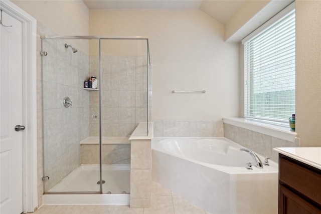 bathroom with separate shower and tub, tile patterned floors, vanity, and lofted ceiling