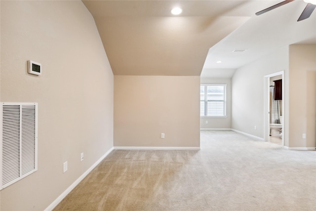 bonus room featuring ceiling fan, light colored carpet, and vaulted ceiling