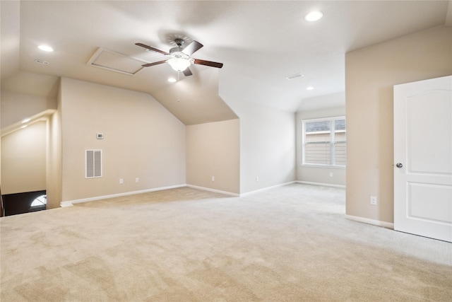 bonus room featuring light carpet and lofted ceiling