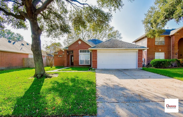 view of front of house with a garage and a front lawn