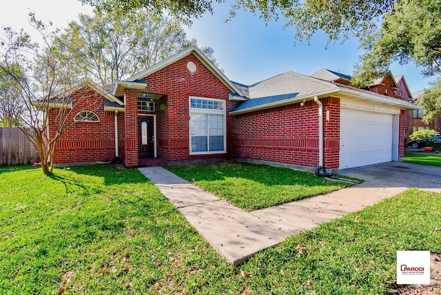 view of front of house with a front yard and a garage