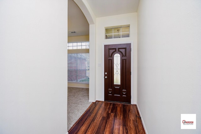 foyer with dark hardwood / wood-style floors