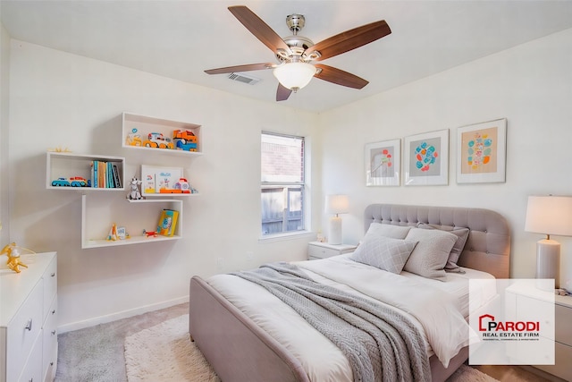 bedroom featuring light carpet and ceiling fan