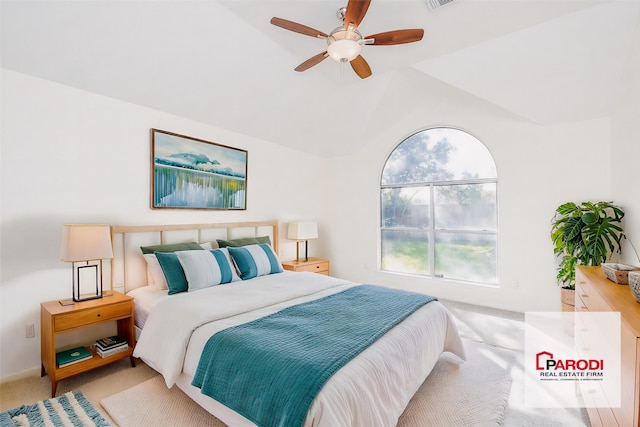 bedroom featuring ceiling fan, light carpet, and vaulted ceiling