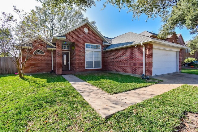 view of front of house featuring a garage and a front yard