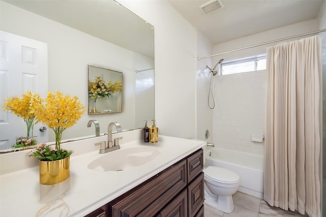 full bathroom featuring vanity, shower / bath combo, and toilet