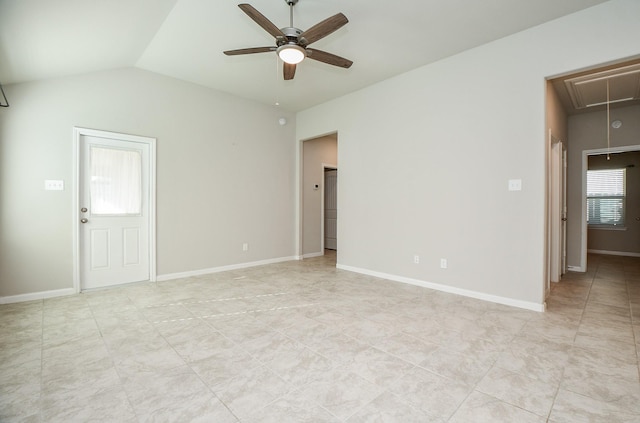 spare room with a wealth of natural light, ceiling fan, and lofted ceiling