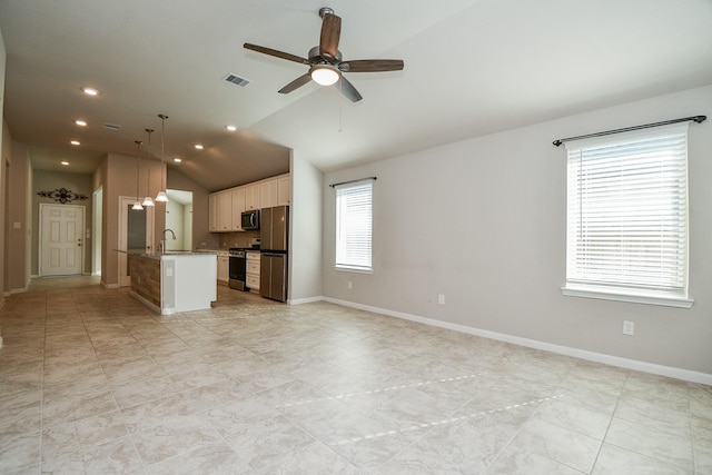 unfurnished living room with ceiling fan, sink, and lofted ceiling