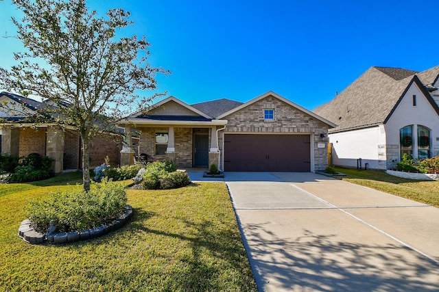 view of front of property with a garage and a front lawn