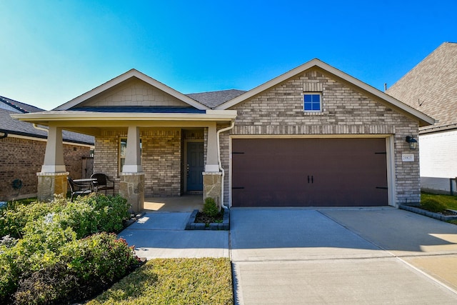 craftsman house with covered porch and a garage