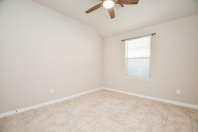 empty room featuring vaulted ceiling and ceiling fan