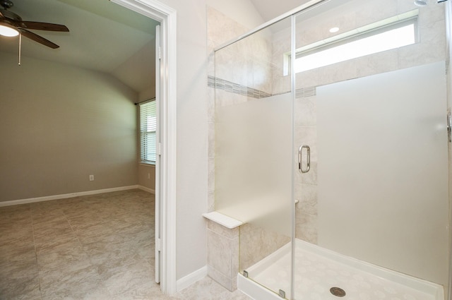 bathroom with ceiling fan, a shower with shower door, and lofted ceiling