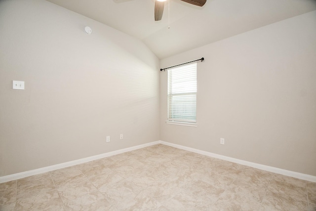 empty room with ceiling fan and lofted ceiling